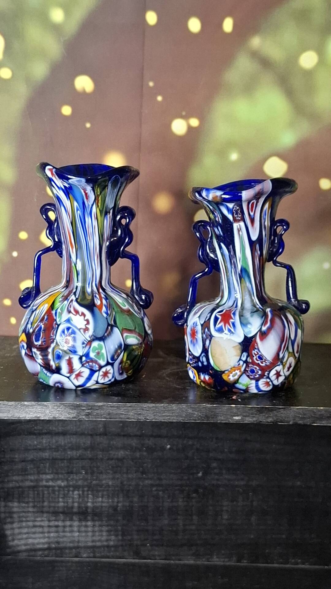 Pair of antique millefiori glass vases attributed to Murano with 2 handles.