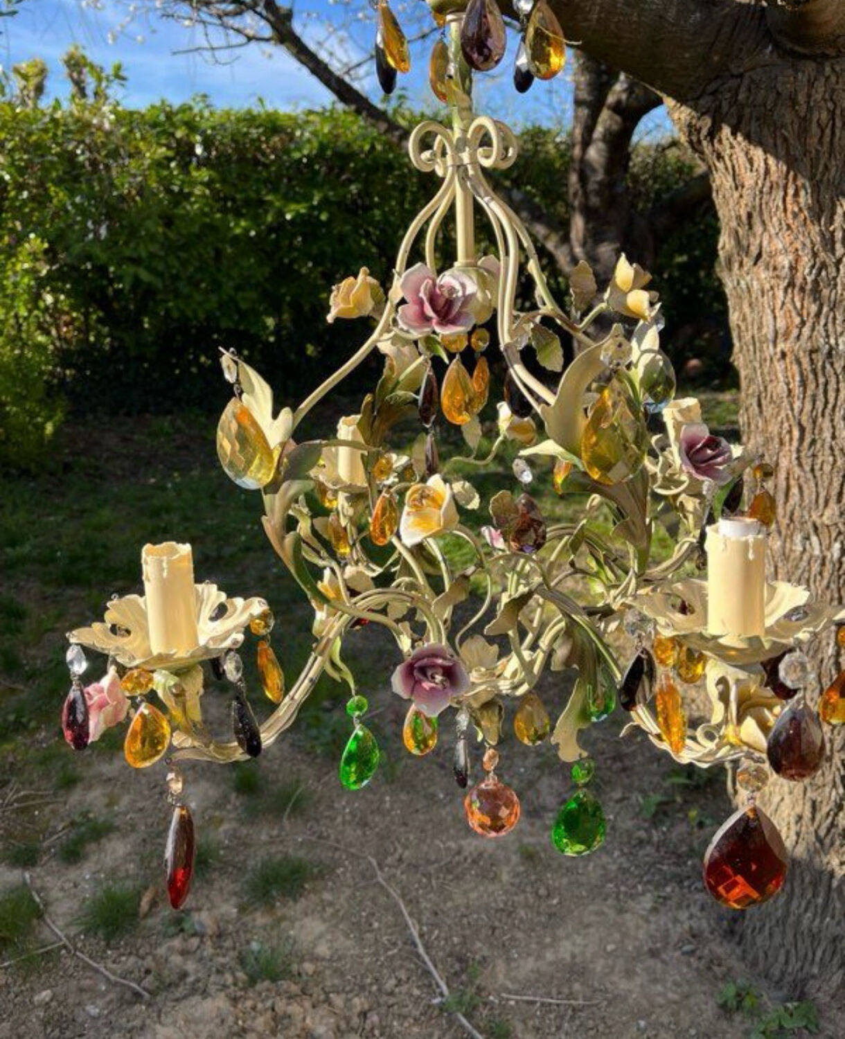 Vintage metal chandelier with porcelain flowers.