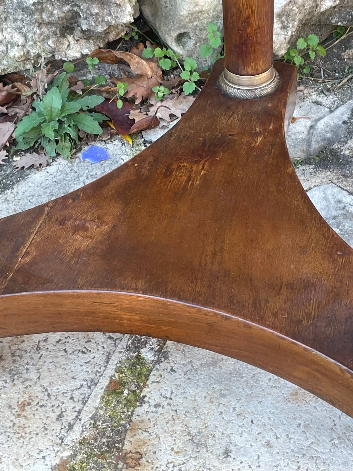Empire style mahogany and mahogany veneer tripod pedestal table