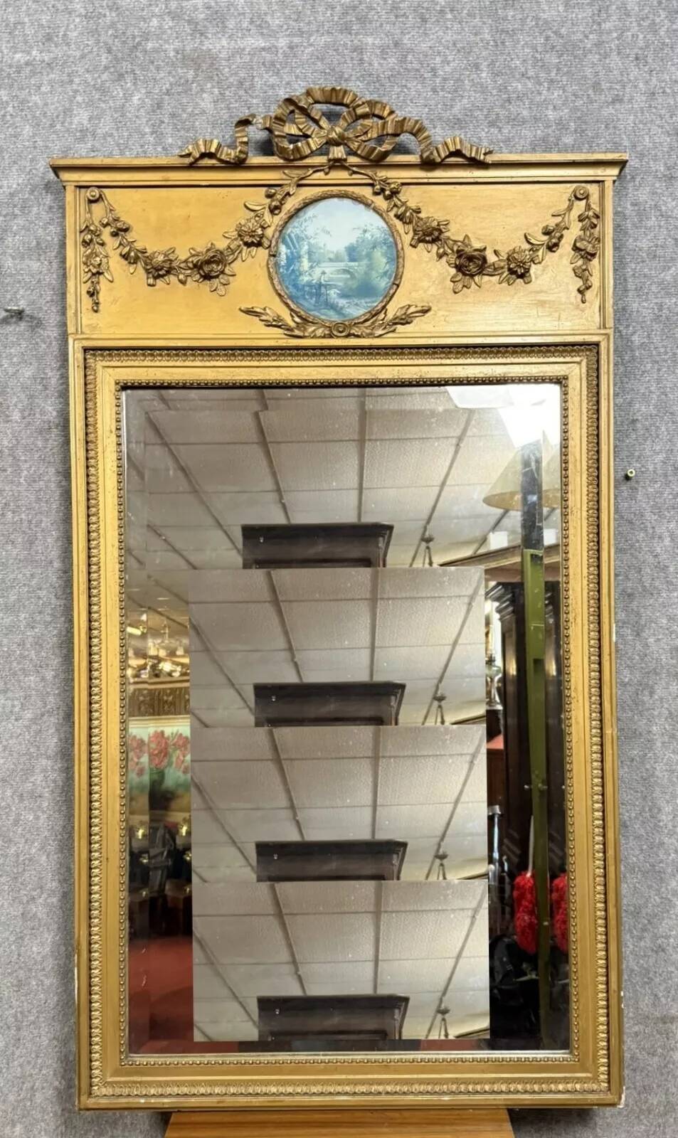 Louis XVI style trumeau mirror in gilded wood, circa 1900