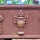 Rusty cast iron jardiniere planter