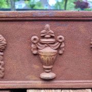 Rusty cast iron jardiniere planter