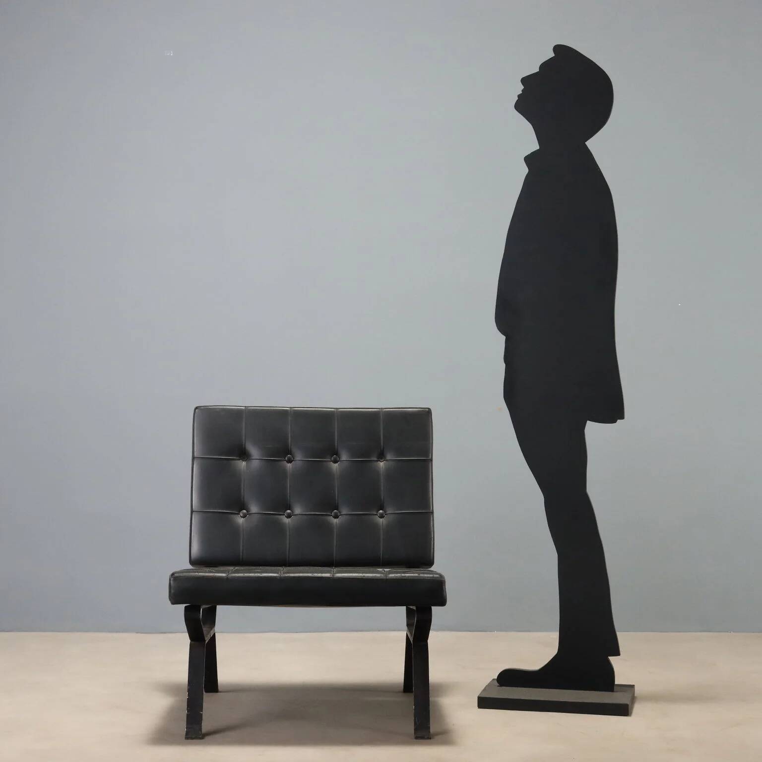 Vintage armchair in metal and black faux leather, Italian design from the 1970s.