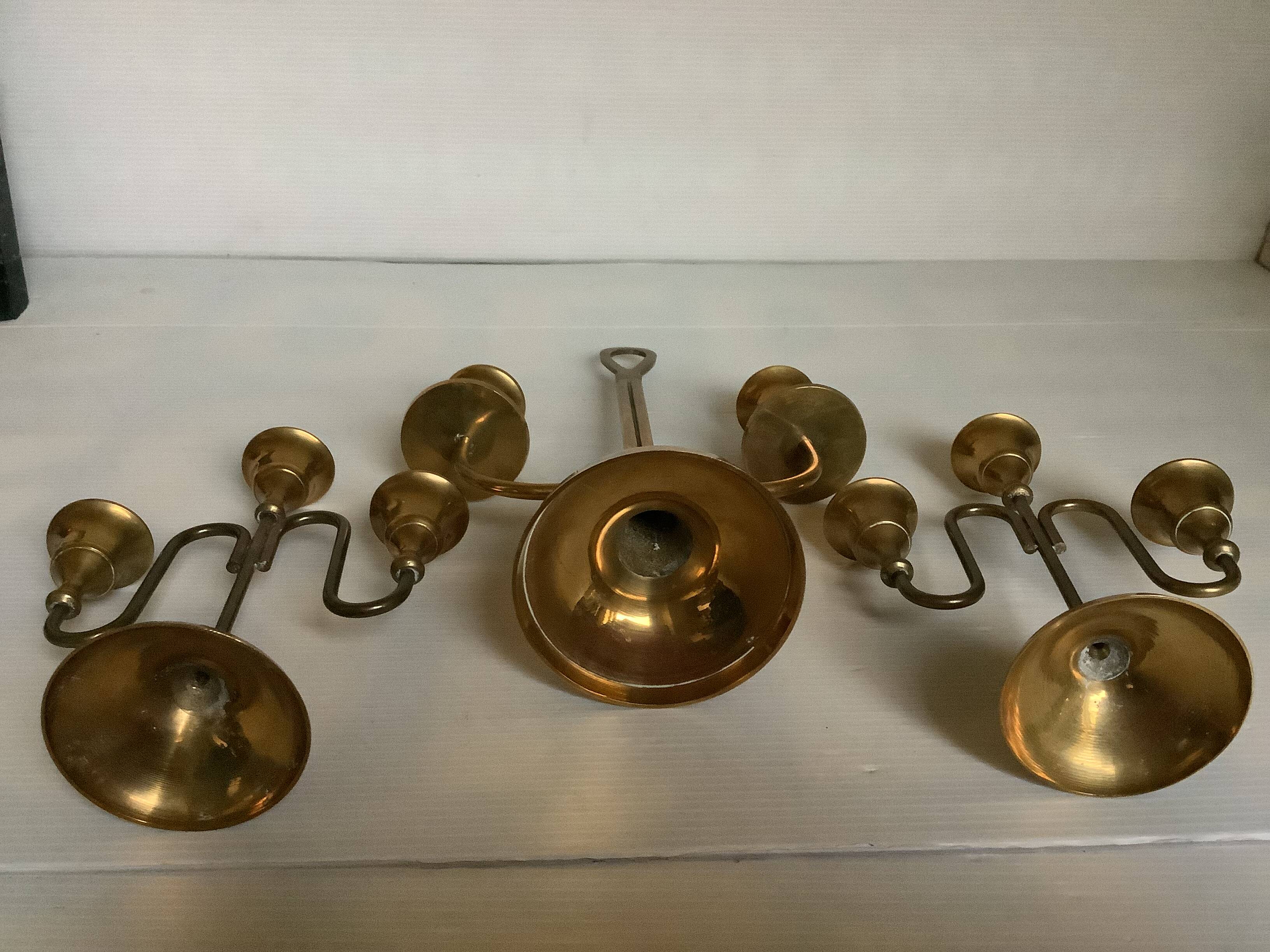 Trio of brass candlesticks with tulip bases
