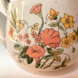 Vintage teapot in stoneware handle in rattan
