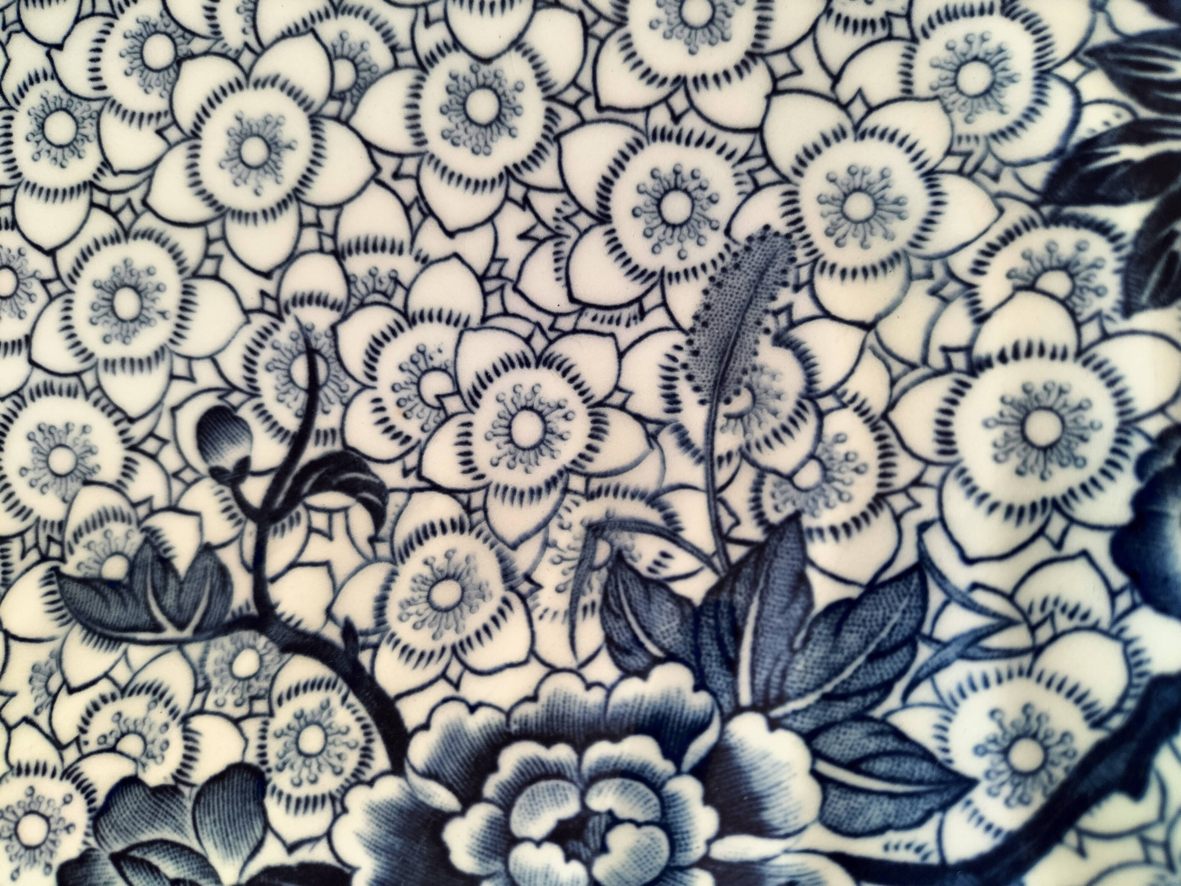 Round antique plate by Johnson Brothers in the Blue Lotus pattern.