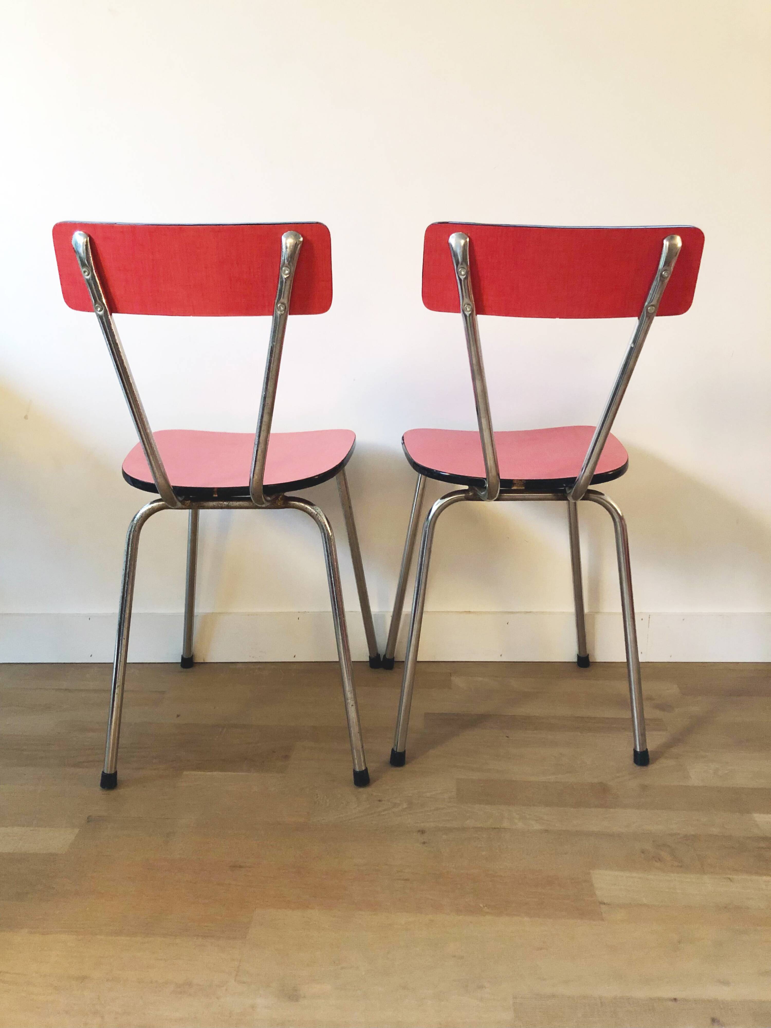 Duo of red formica chairs
