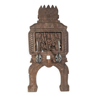 Coat rack with 2 hooks on a frieze of divinities in teak