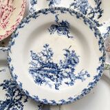 10 mismatched vintage soup plates in blue, green, and red ironstone