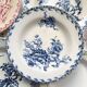 10 mismatched vintage soup plates in blue, green, and red ironstone