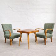 Halabala “Spider” coffee table and Hungarian late Art Deco armchairs, 1950s