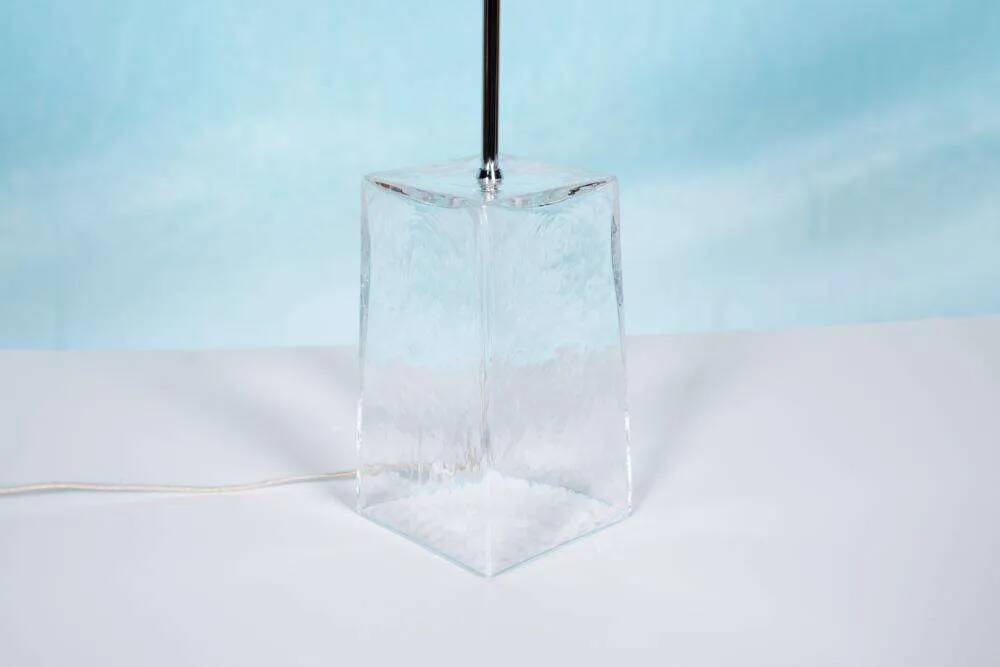 Minimalist glass table lamp from the 80s with a pleated shade.