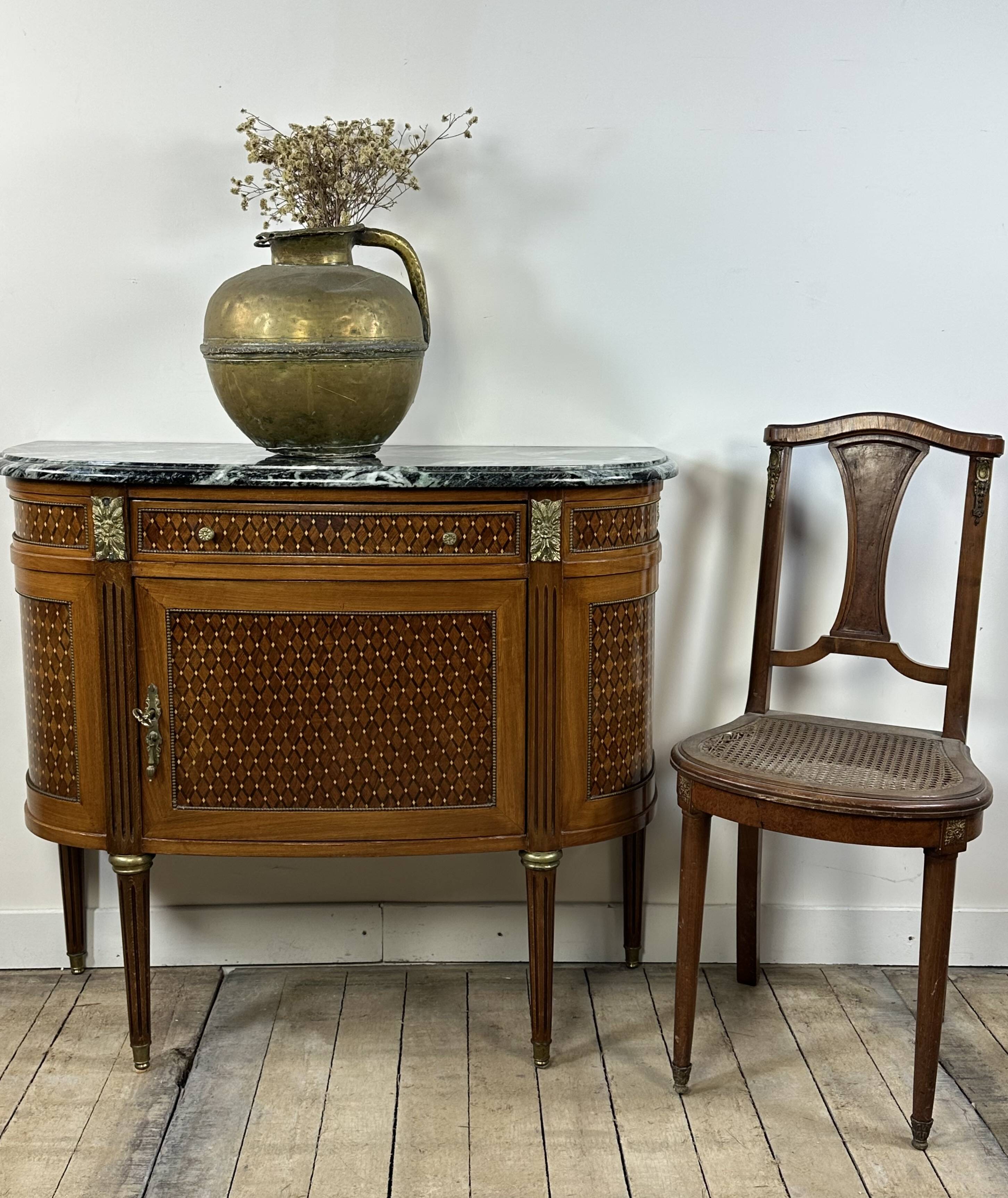 Half-moon commode in the Louis XVI style