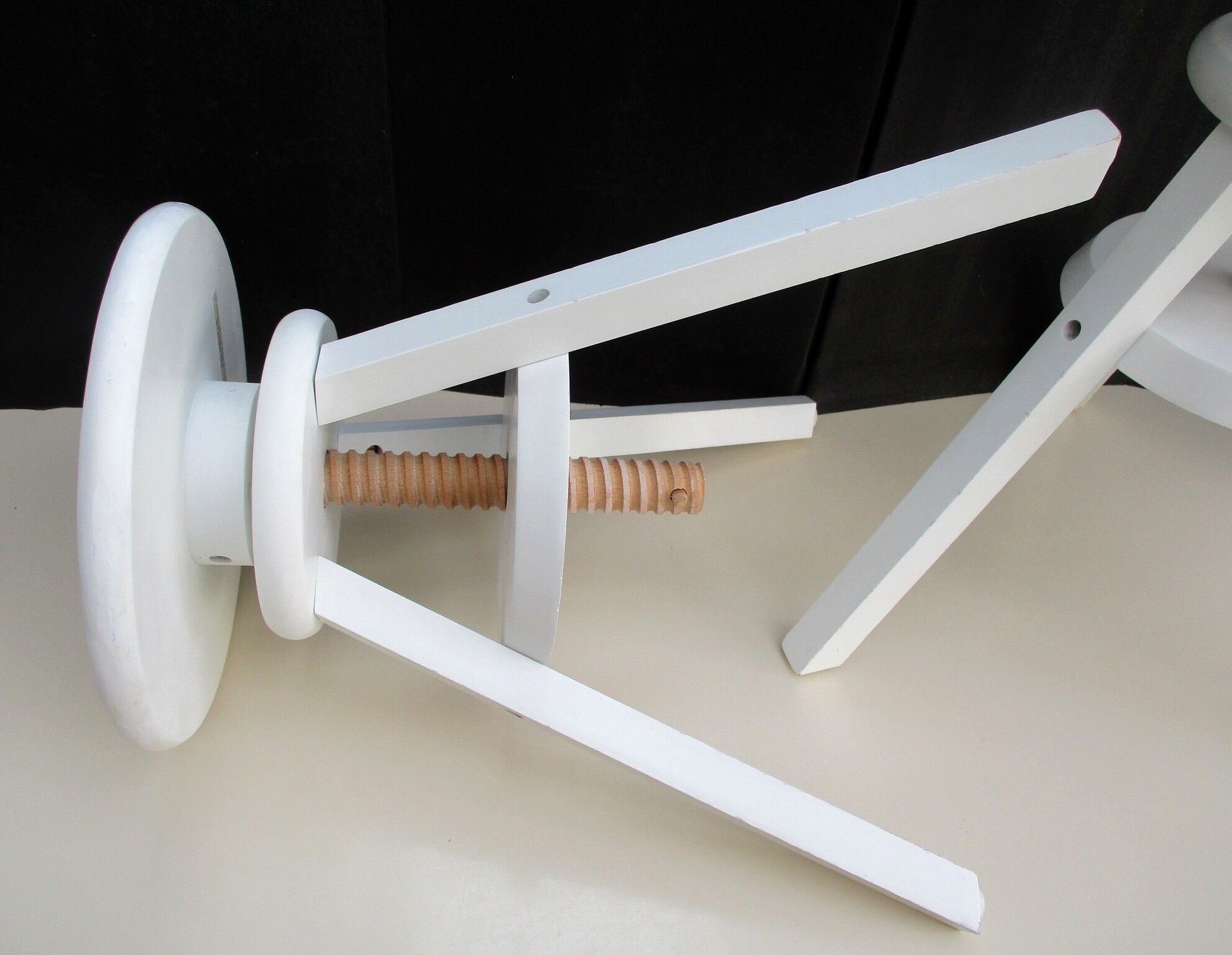 Two wooden screw stools for children