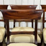 Set of 2 armchairs and 6 English mahogany chairs from the 1950s.