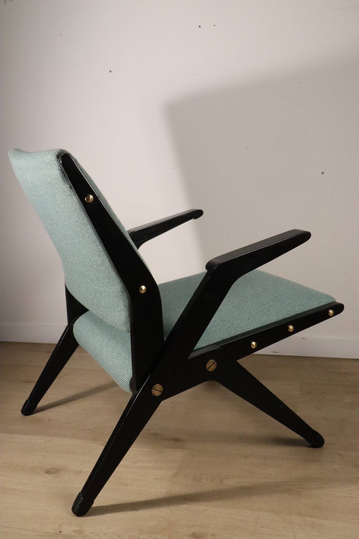 Vintage armchair from the 1960s in black wood and fabric.