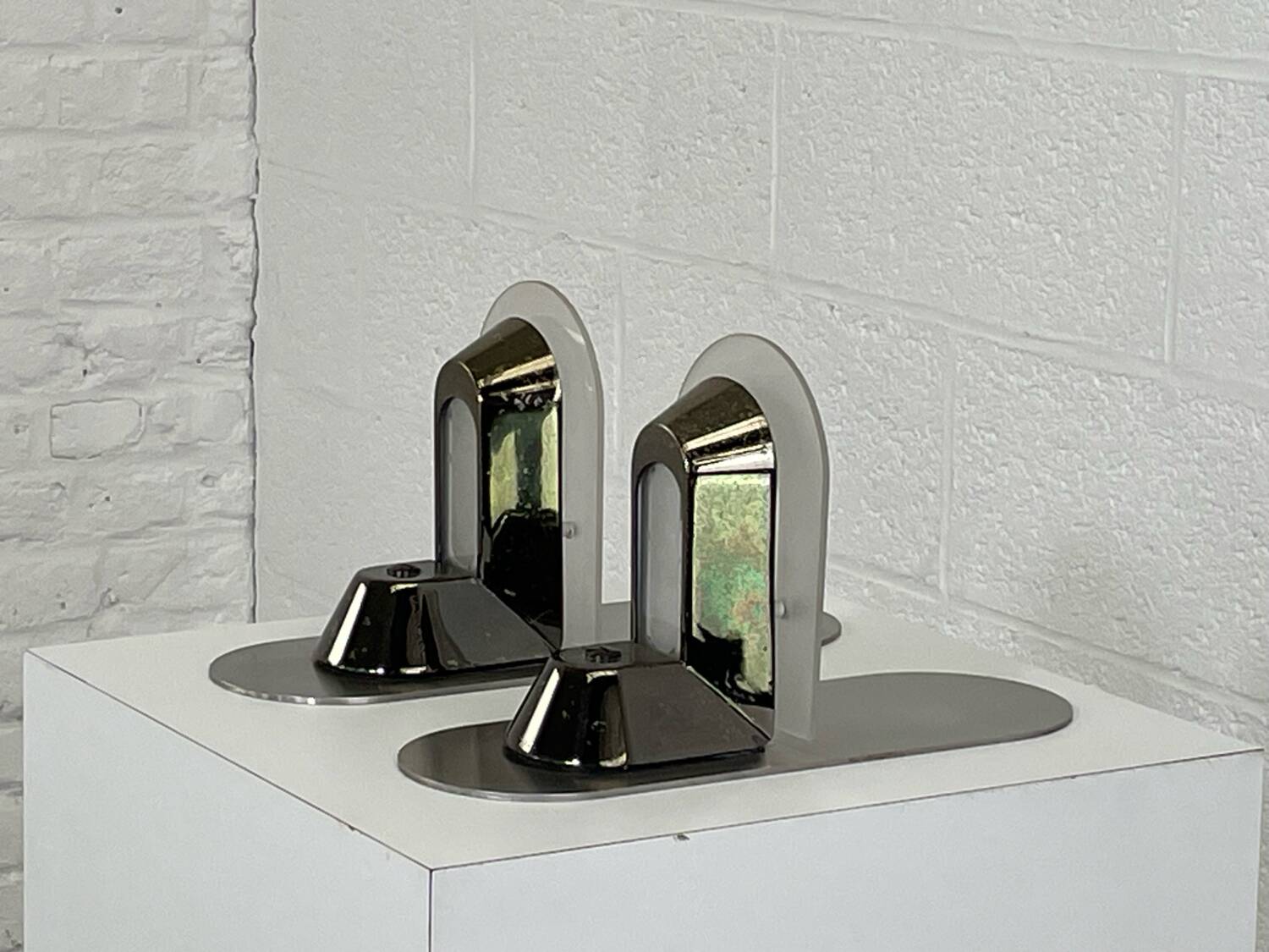 Pair of vintage stainless steel and glass wall lights