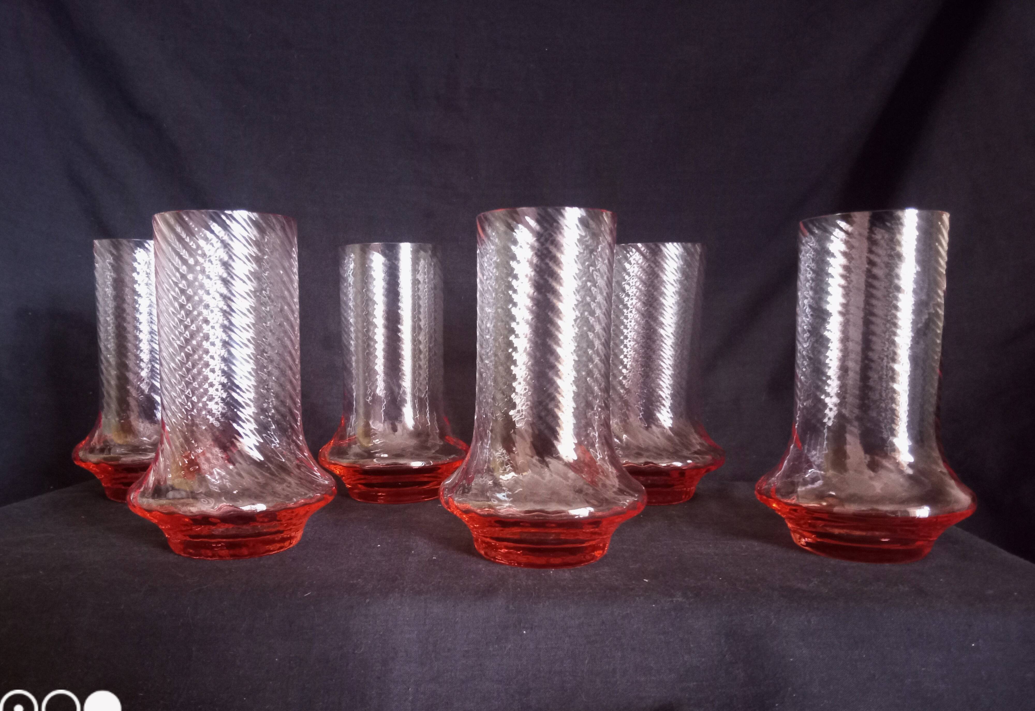 Art Deco orangeade service in pink-orange glass, twisted model.