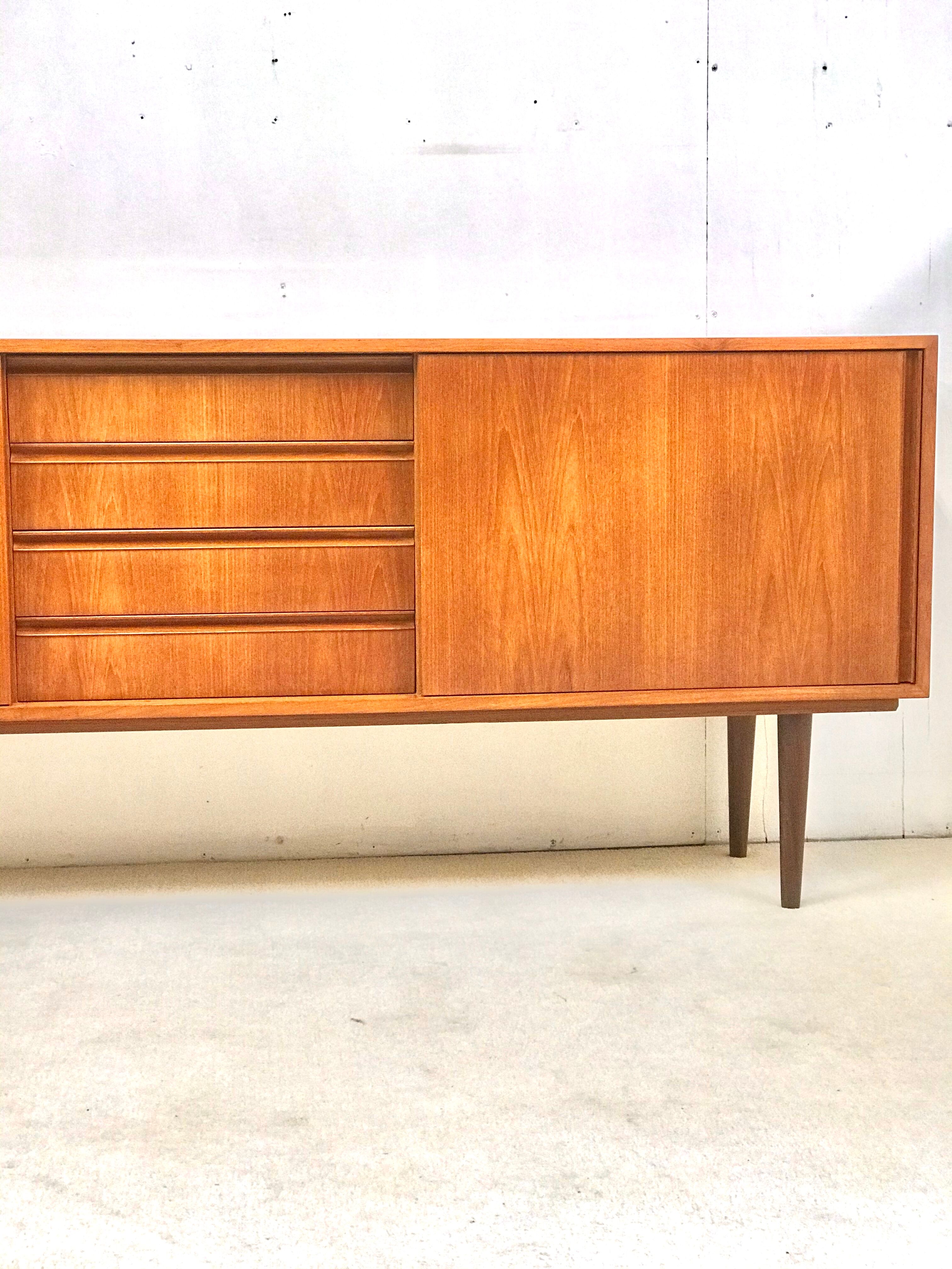 Danish teak sideboard with two sliding doors and 4 central drawers