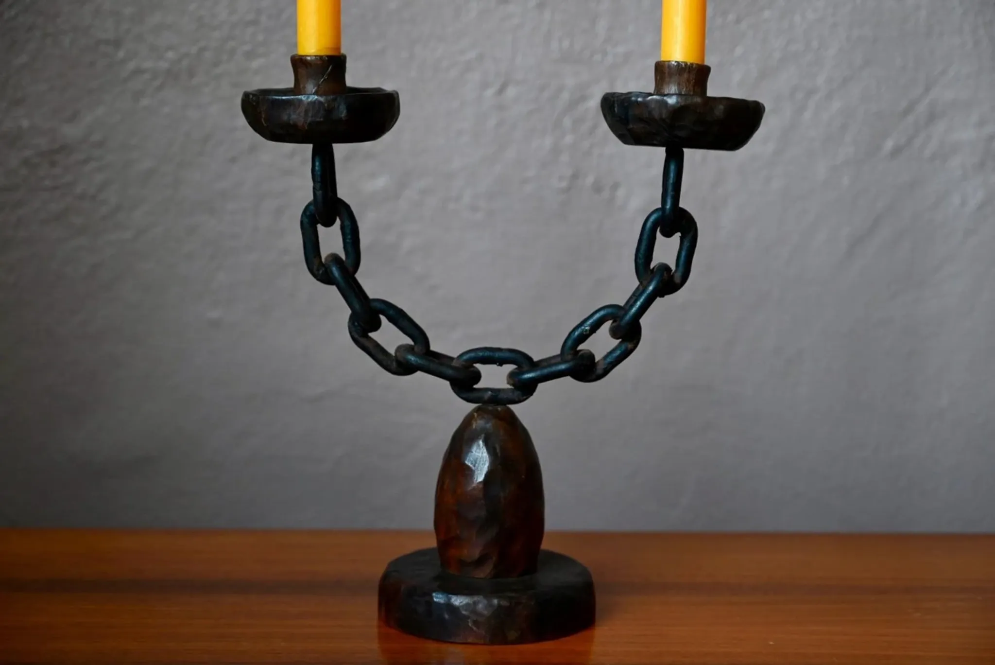 Sculpted wooden and wrought iron brutalist double chandelier from the 1960s.