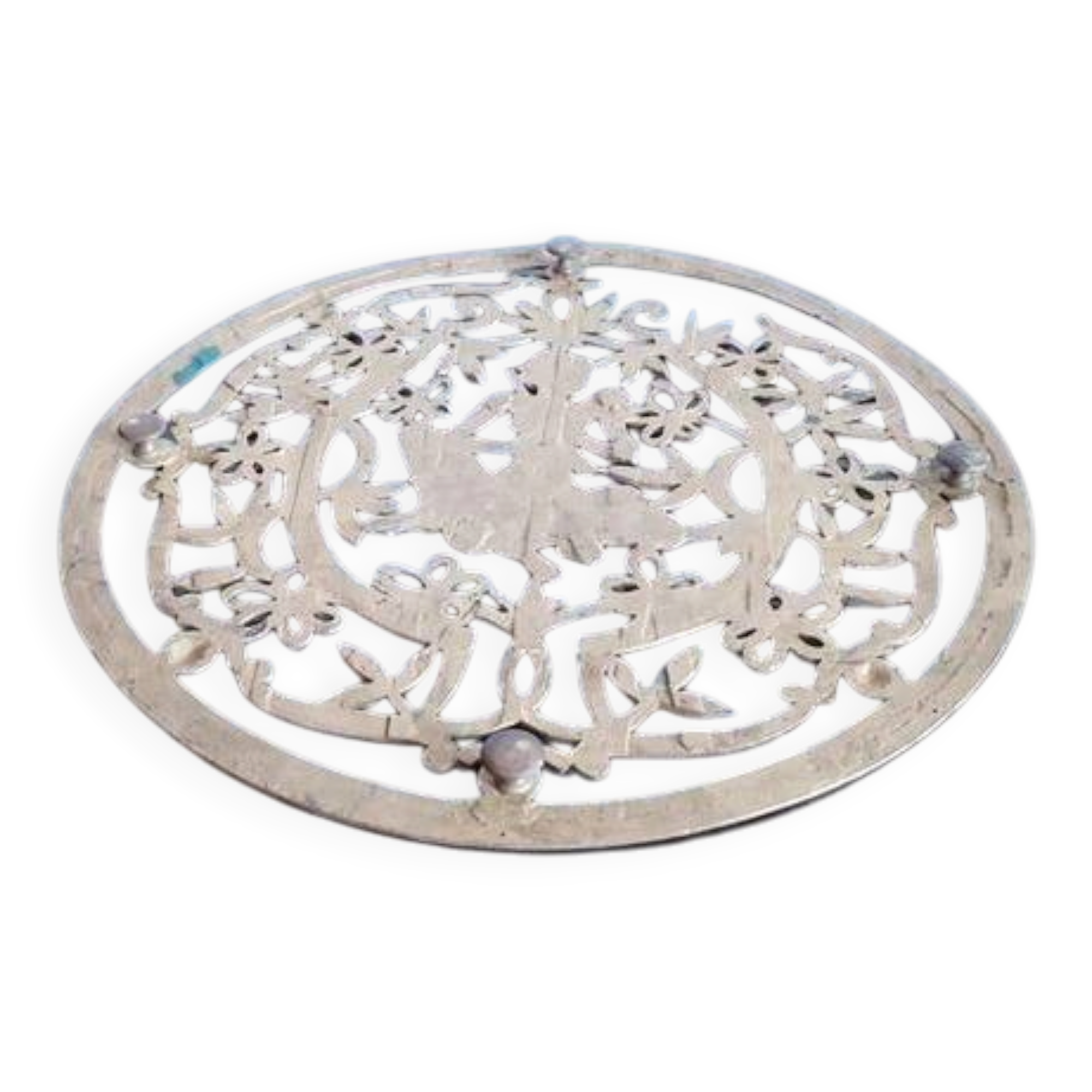 Old metal trivet