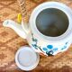Vintage teapot in stoneware and wicker