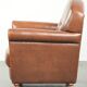 Armchair made of sheepskin leather with refined decorative nail finish