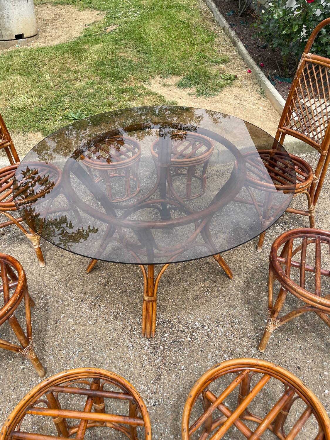 Vintage rattan dining set with glass table, 4 chairs and 4 stools.