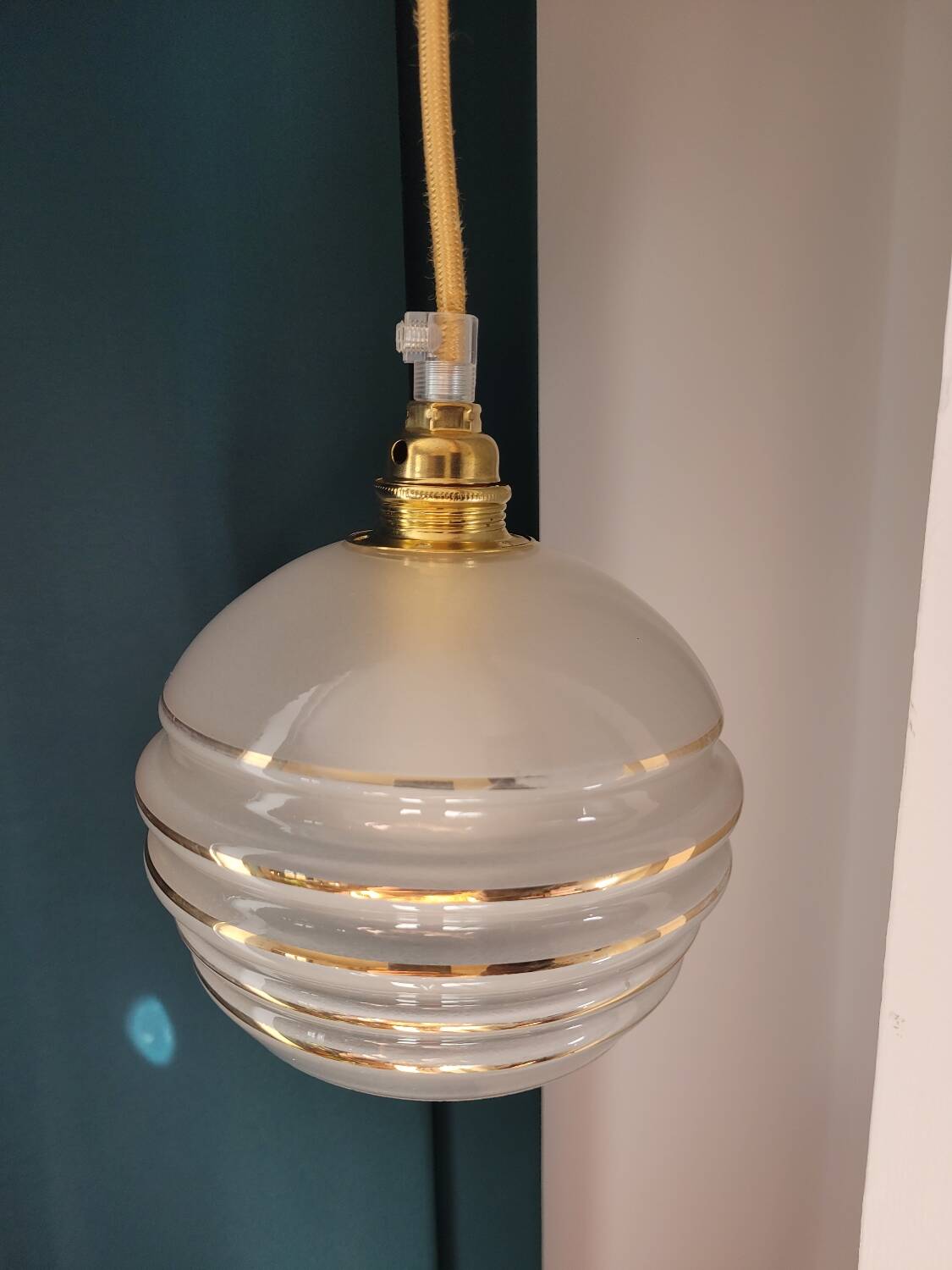 Frosted glass lamp with golden trims