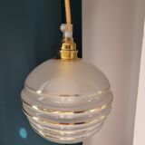 Frosted glass lamp with golden trims