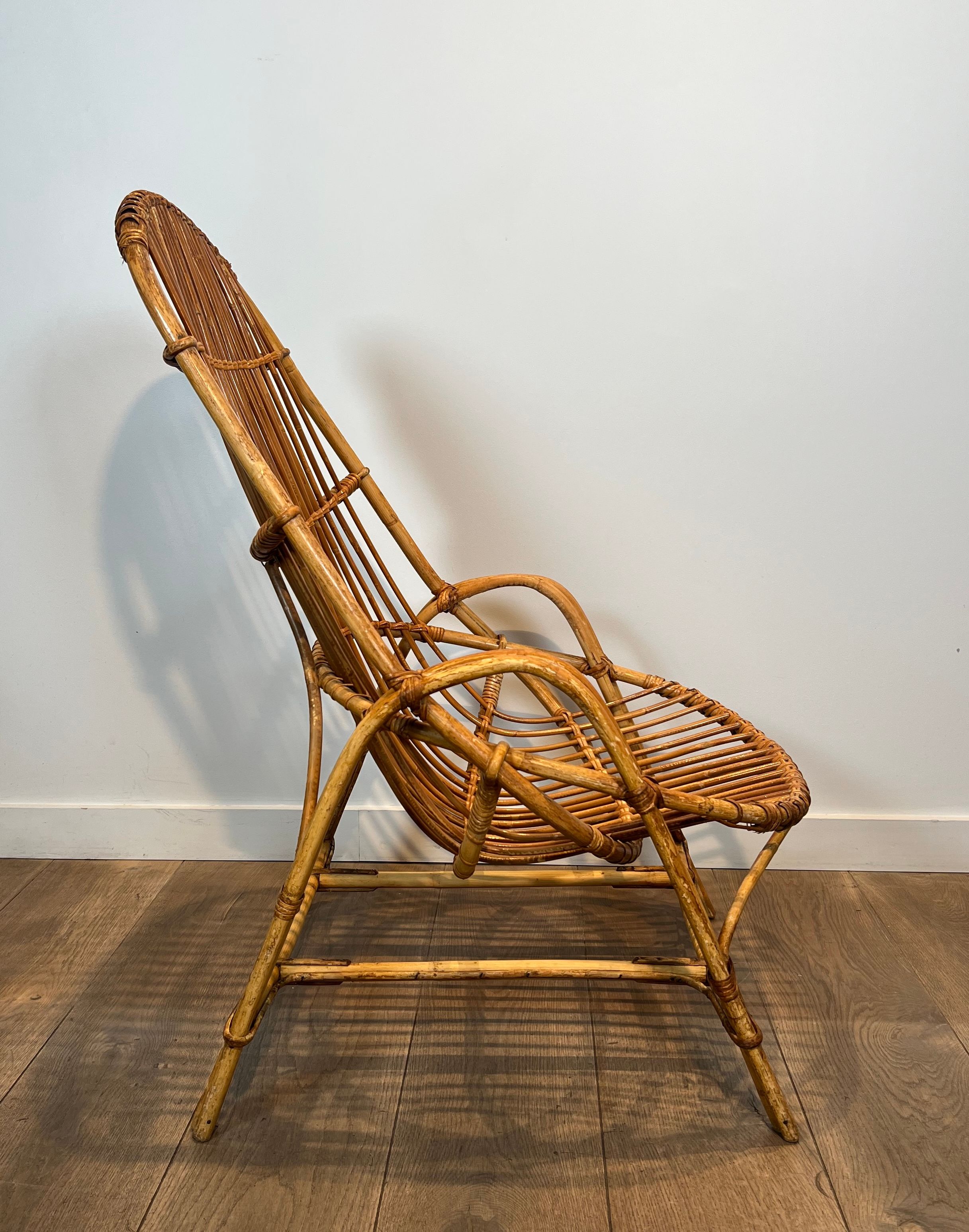 Pair of designer armchairs in rattan