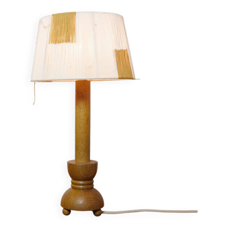 Wooden candle holder mounted as a lamp and its rope shade, 47.5cm.