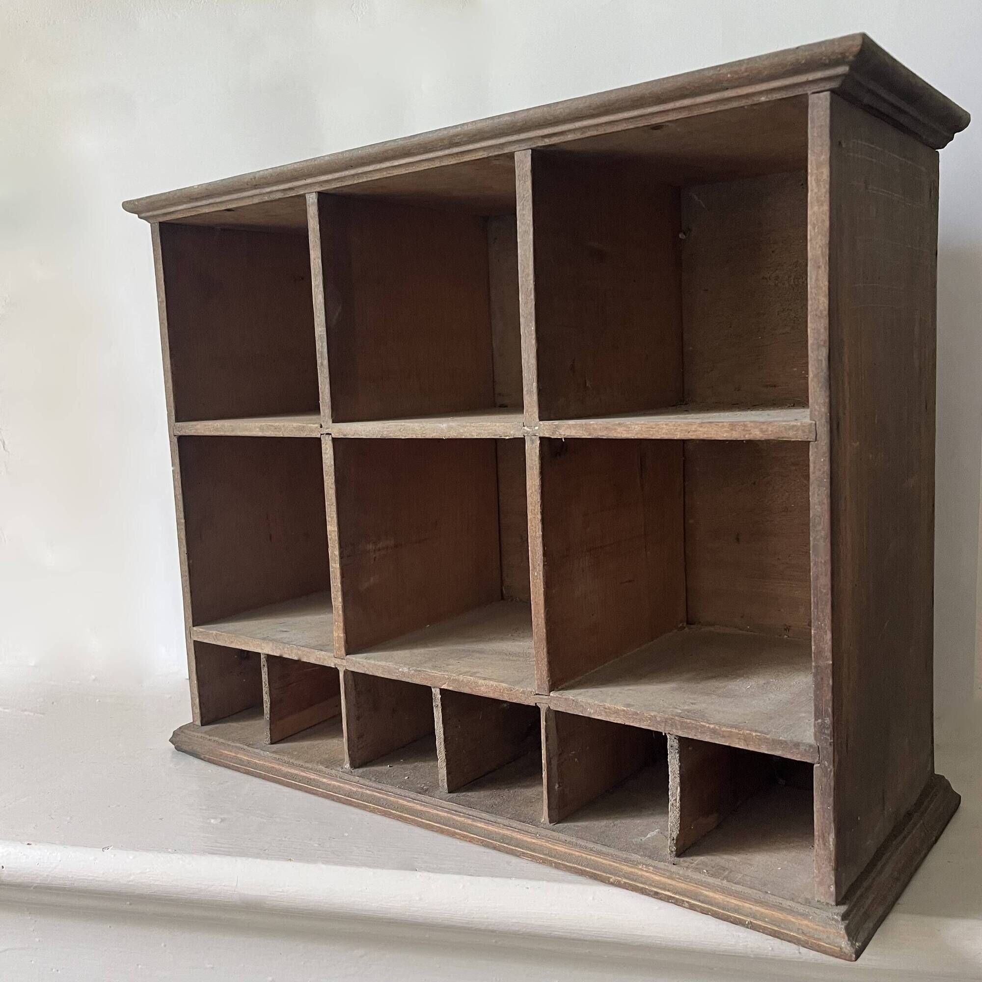 Antique commercial shelving unit with compartments