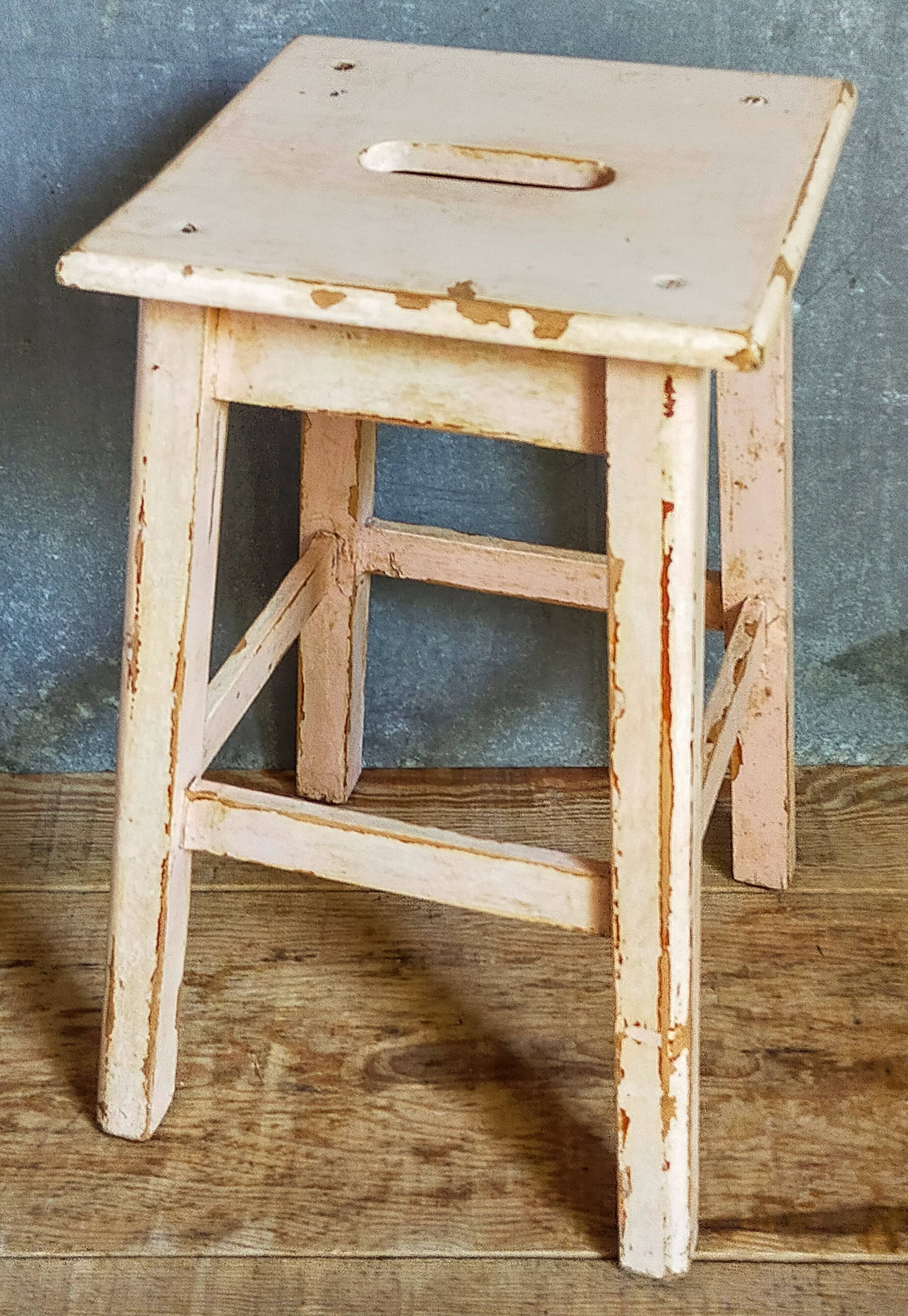 Antique workshop stool in patinated solid wood