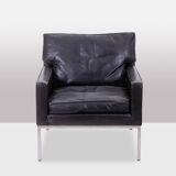 Pair of armchairs in black leather and chrome metal. 1970s.