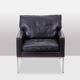 Pair of armchairs in black leather and chrome metal. 1970s.