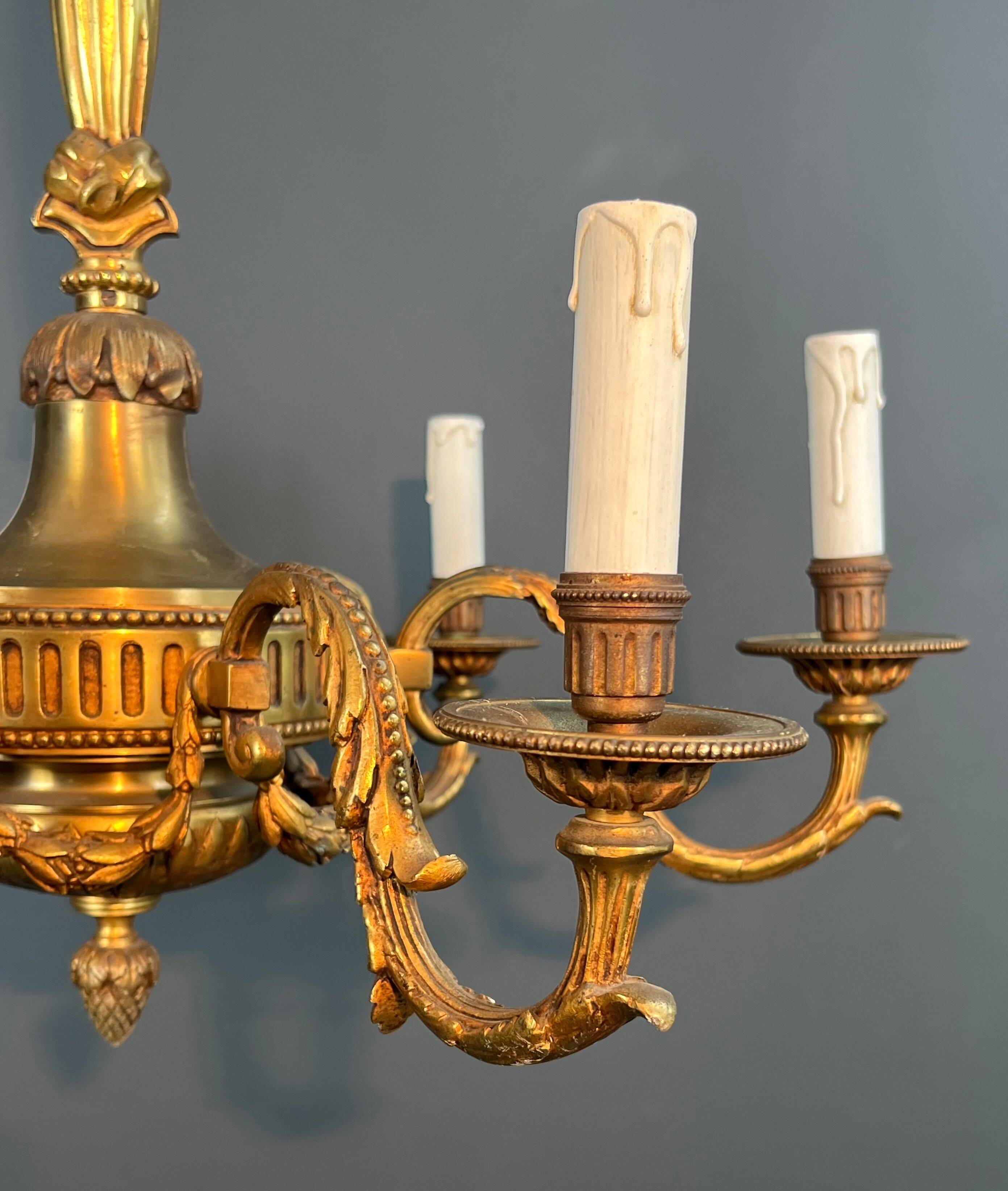 Bronze chandelier in Louis XVI style with 6 arms.