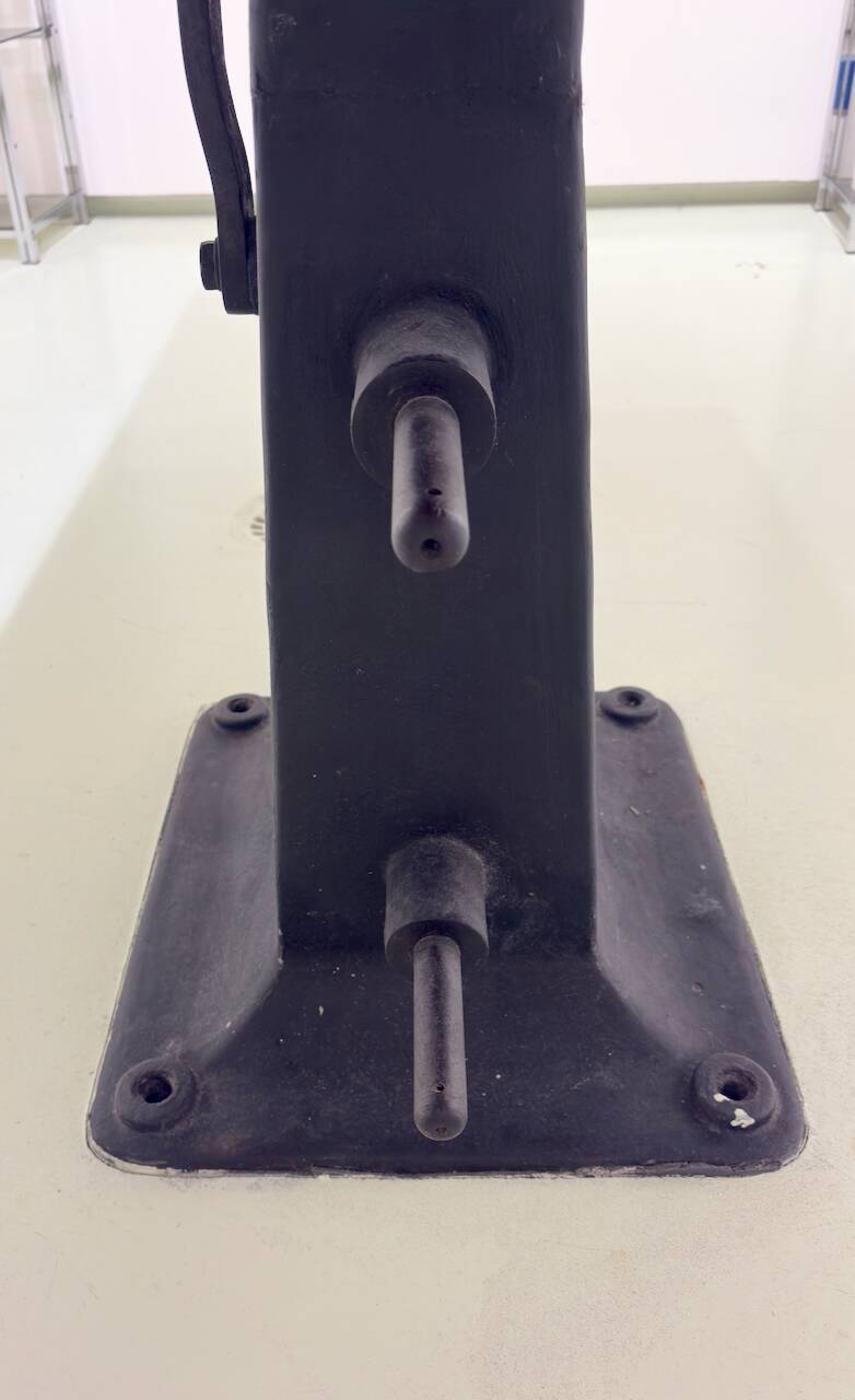 Industrial table with cast iron legs.