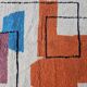 Traditional handmade wool Berber rug with colourful patterns.