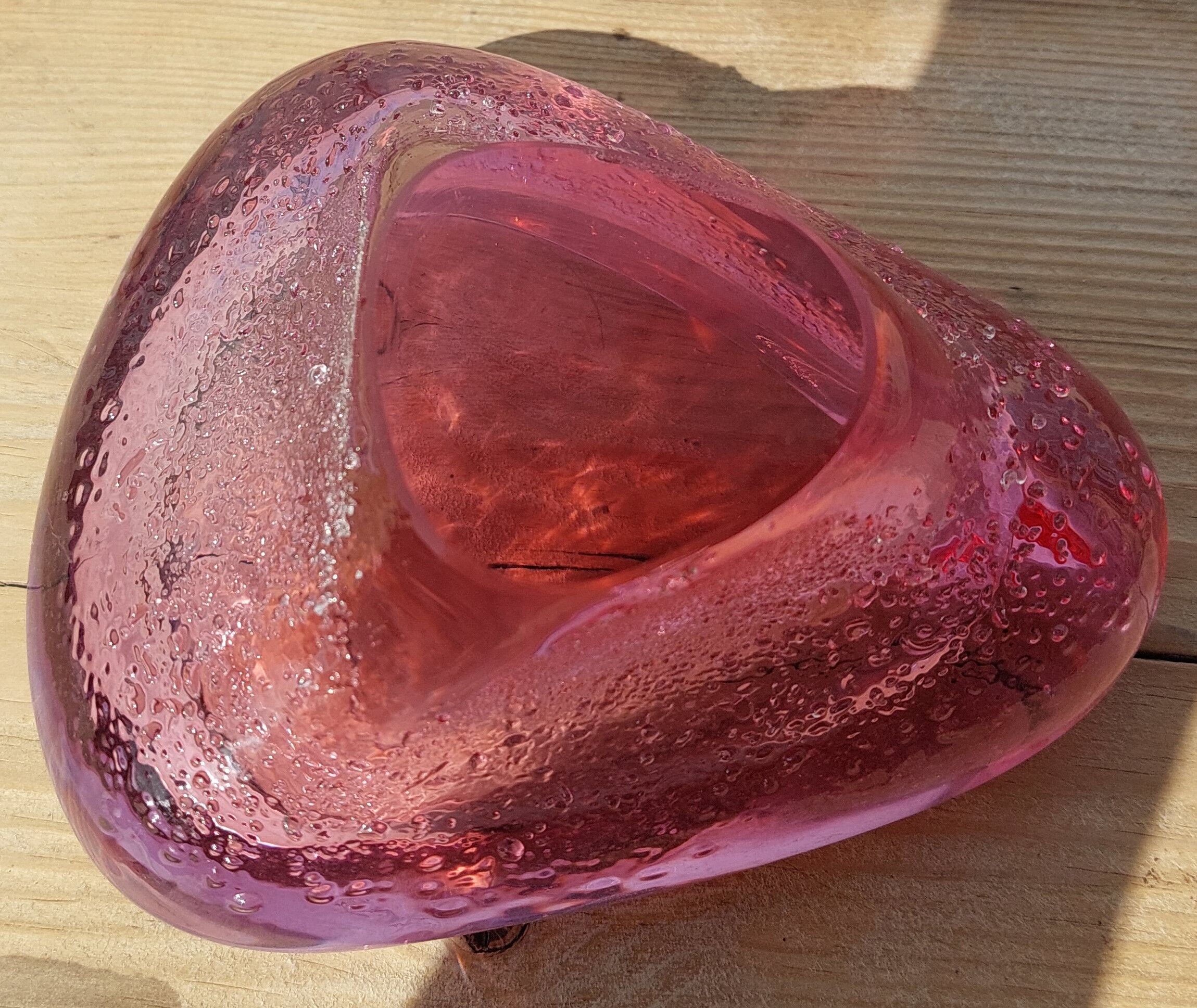 Empty pink blown glass pocket