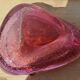 Empty pink blown glass pocket