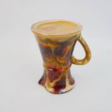 Beautiful ceramic pitcher in fire colors