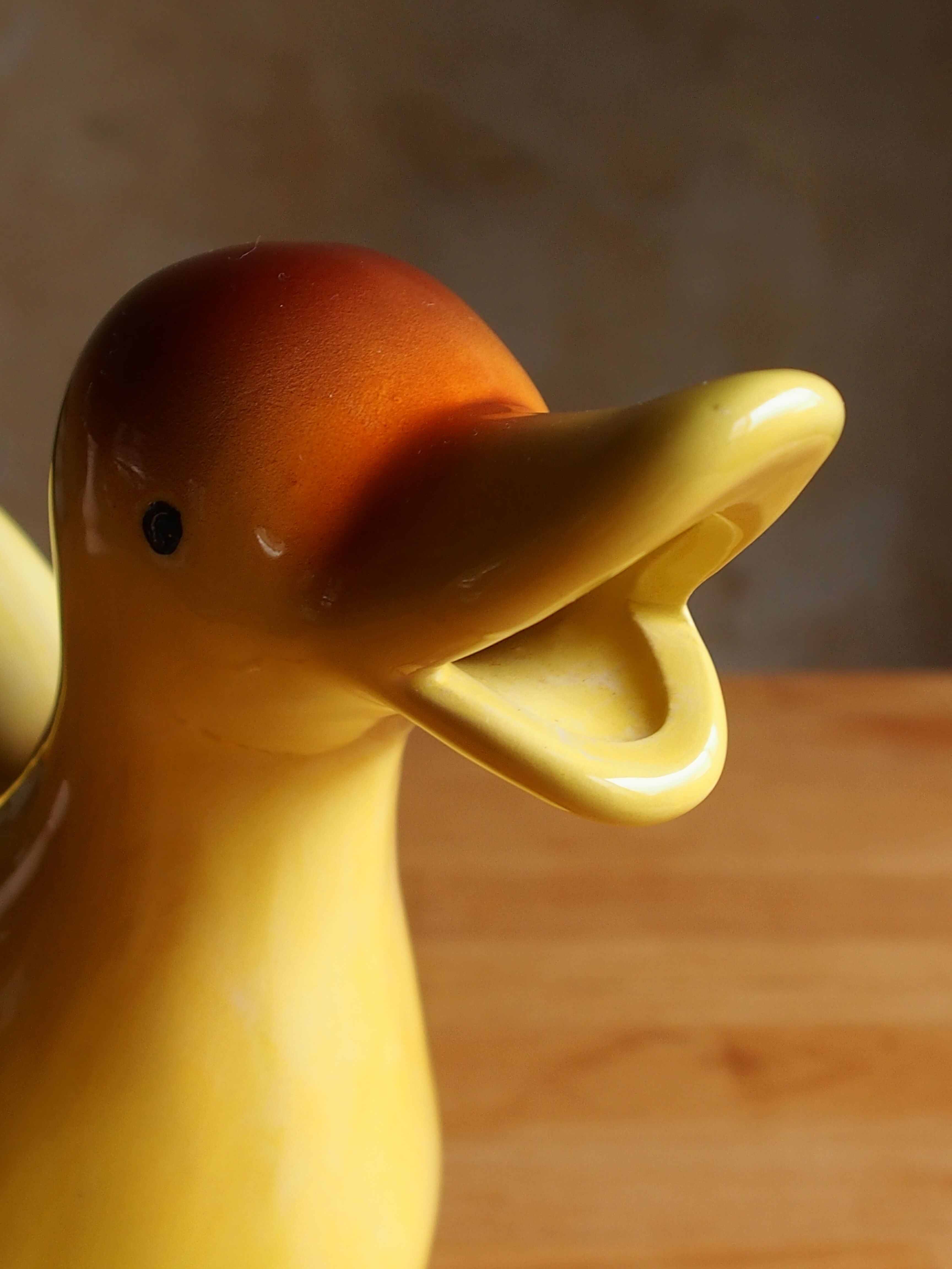 Ceramic watering can in white earthenware, yellow enamel and bird shape