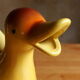 Ceramic watering can in white earthenware, yellow enamel and bird shape