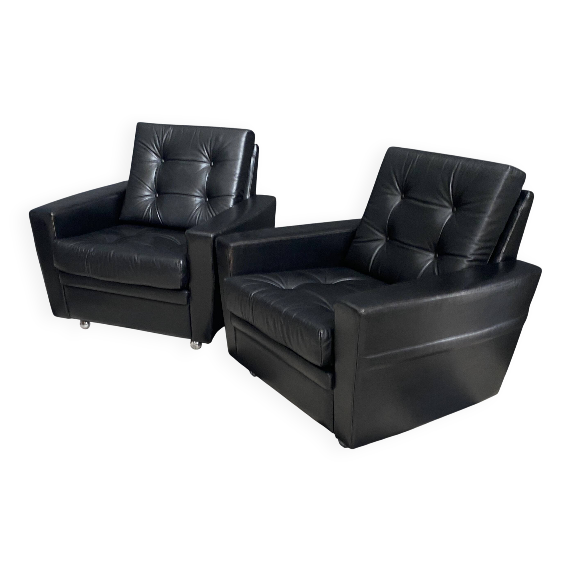 2 Black leather arm chairs 1960s on wheels