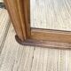 Miroir art déco biseauté , bois sculpté