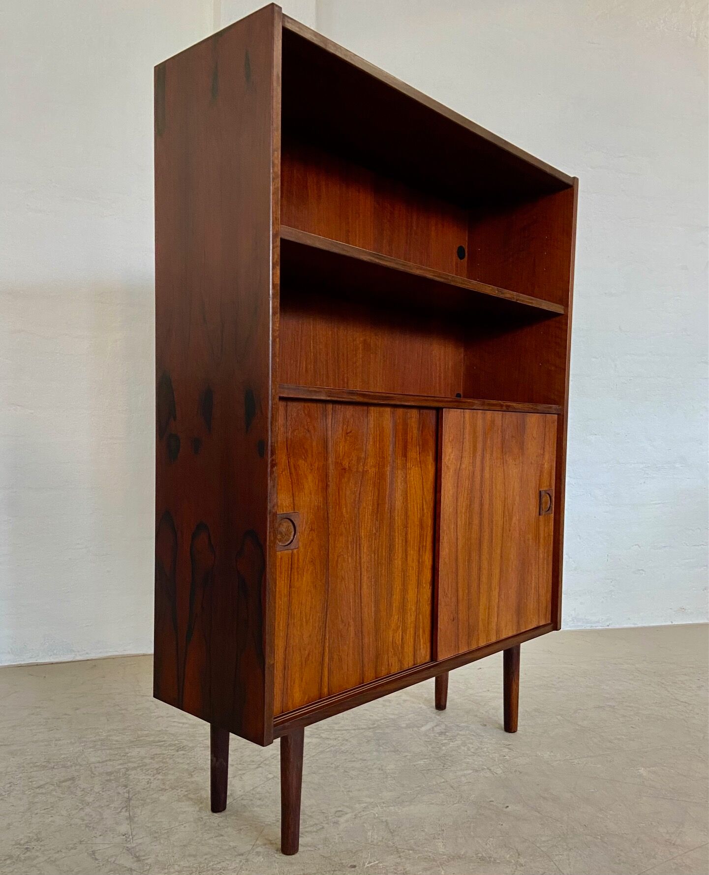 Danish retro vintage library in rosewood with sliding doors from the 1960s.