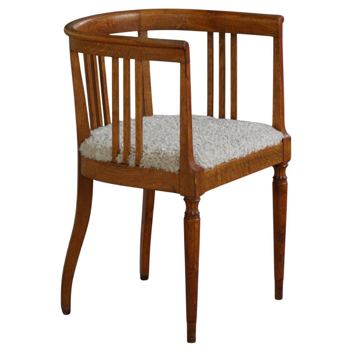 Fauteuil danois Art Nouveau en chêne avec assise rembourrée en laine d'agneau, début 1900