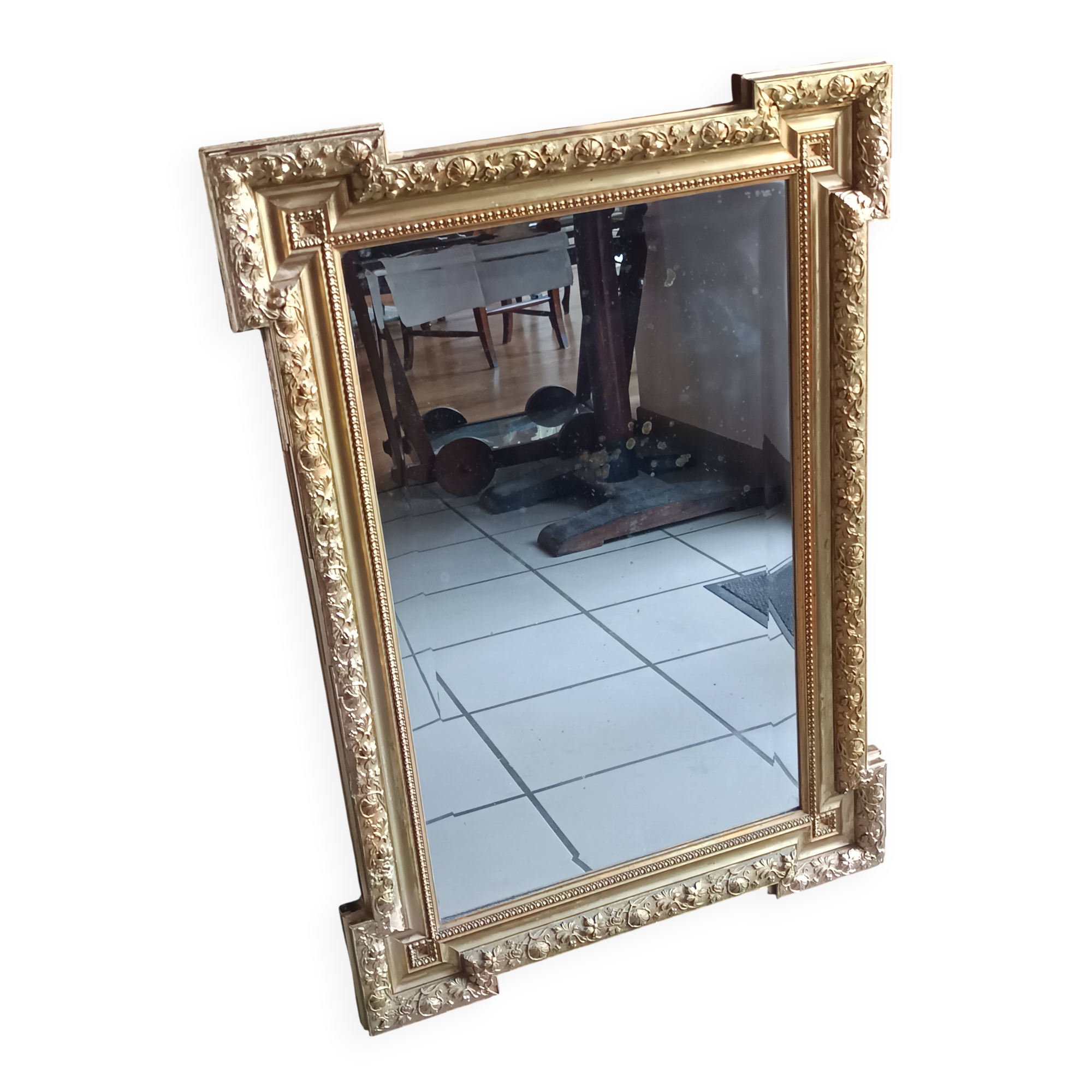 Antique mirror in wood and gilded stucco, neo Louis XVI style.