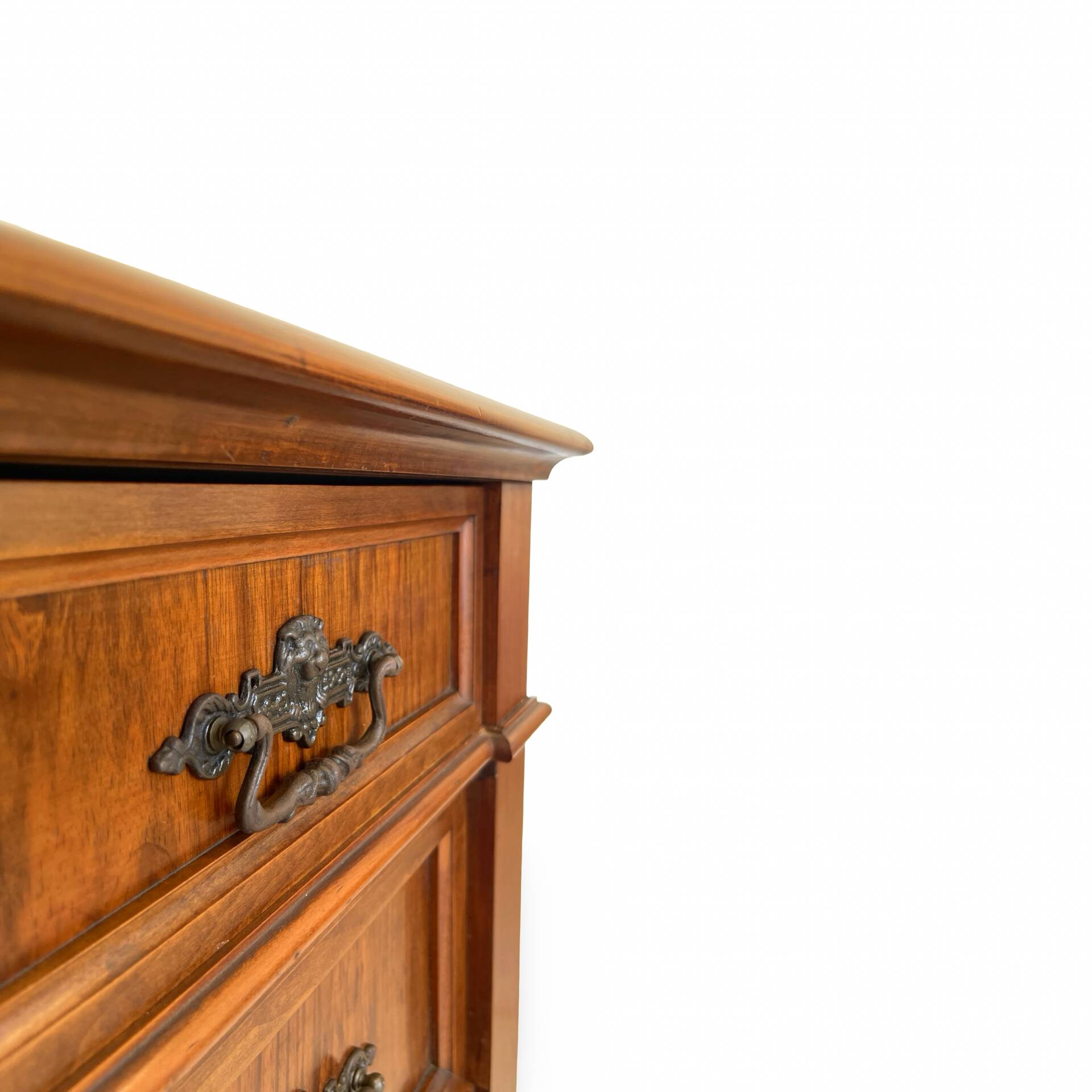 Antique walnut commode with bronze handles in the shape of a lion's mask,